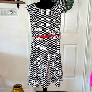 Black/White dress with red belt.